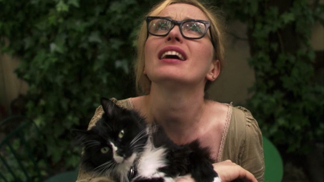 2 Days in Paris - Marion Julie Delpy holding tuxedo cat Max