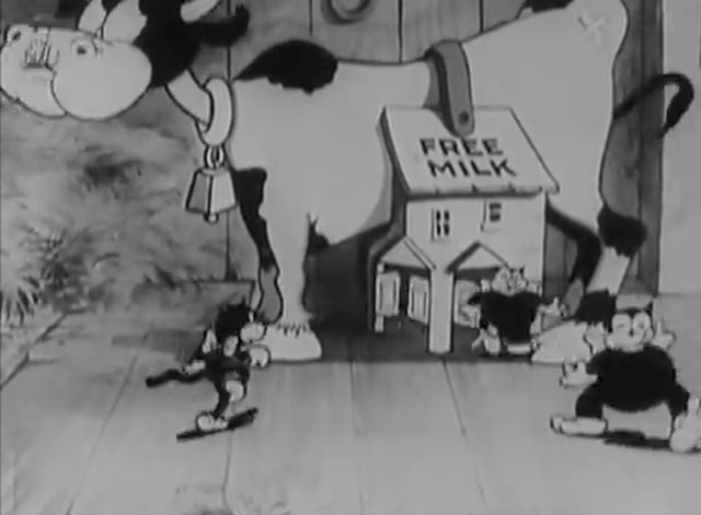 Ain't She Sweet? - fat cartoon black cats filling up on free milk from cow