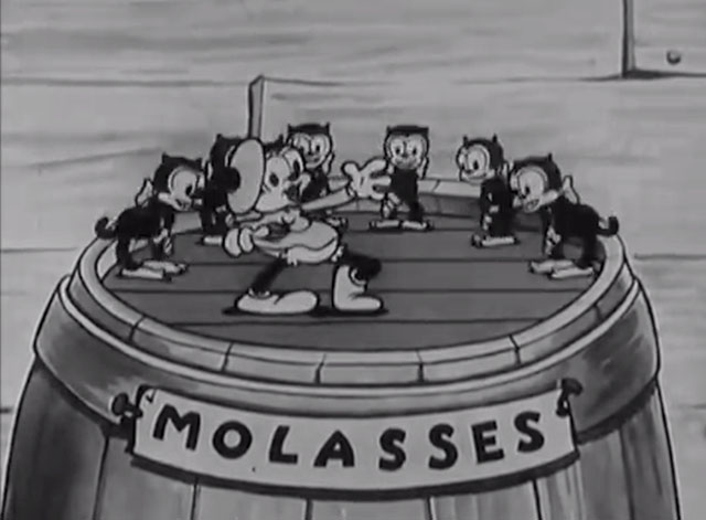 Ain't She Sweet? - cartoon black cats dancing on top of molasses barrel