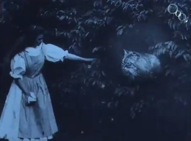Alice in Wonderland 1903 - Cheshire Cat looking at Alice May Clark waving