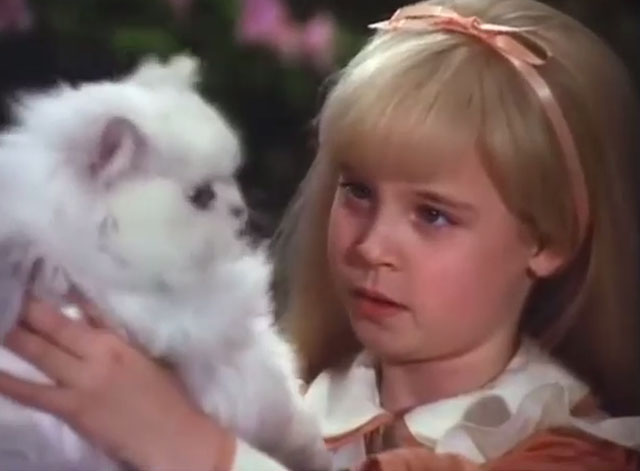Alice in Wonderland - Alice Natalie Gregory holding up Persian white cat Dinah