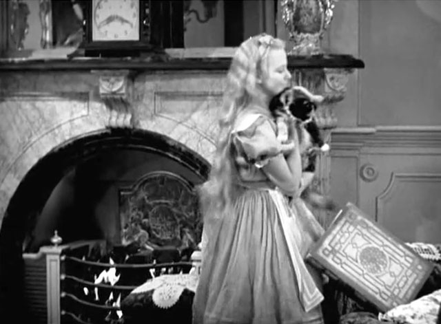 Alice in Wonderland - Alice Charlotte Henry lifting longhair calico cat Dinah from chair