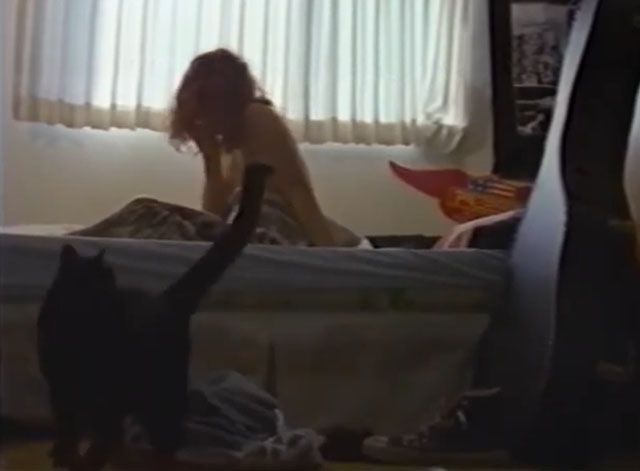 Alien Beach Party Massacre - black cat approaching bed of Glue Eric Zumbunnen