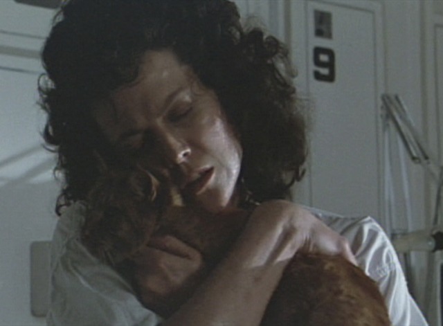 Aliens - Ripley Sigourney Weaver hugging orange tabby cat Jones