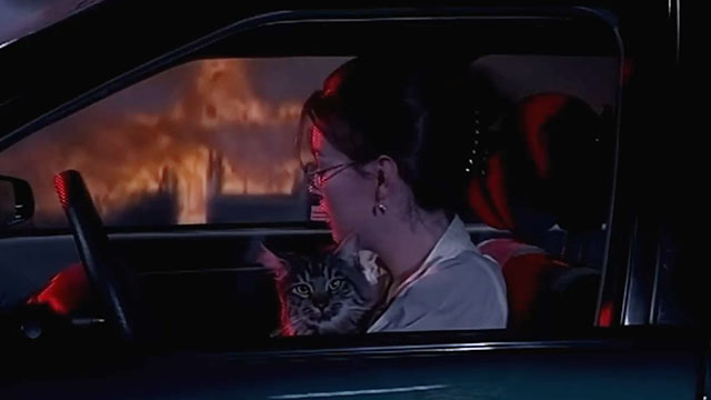 Alien Species - Holly Barbara Fierentino with longhair tabby cat Roy Bubba in car with house burning in background