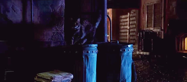 Alita: Battle Angel - longhaired tabby cat on garbage cans