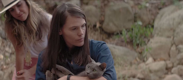 All About Nina - woman holding gray blue cat