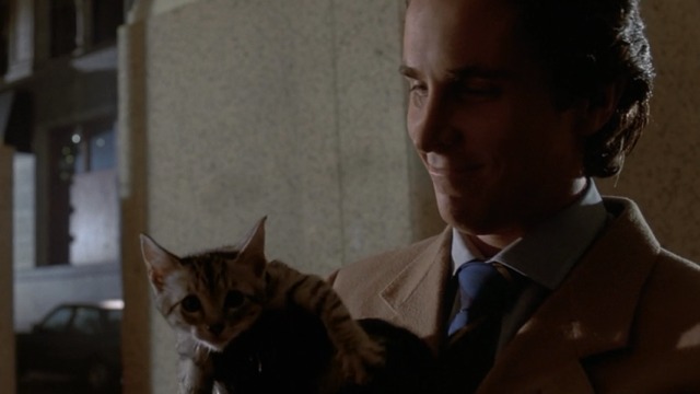 American Psycho - Patrick holding tabby kitten