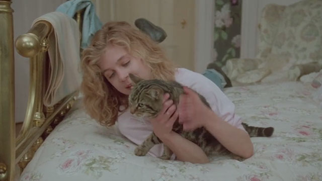 Amityville Horror The Evil Escapes - Amanda Geri Betzier on bed with tabby cat Pepper