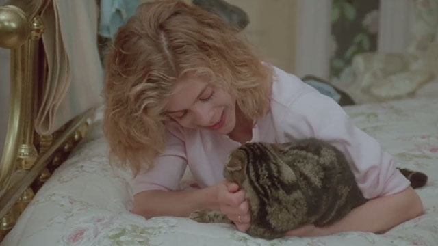 Amityville Horror The Evil Escapes - Amanda Geri Betzier on bed with tabby cat Pepper