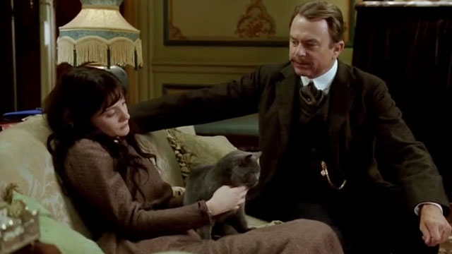 Angel - blue shorthair cat sitting on lap of Romola Garai with Gilbright Sam Neill