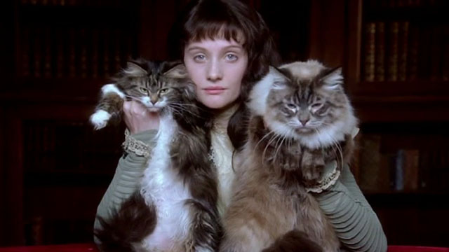 Angel - Romola Garai holding two longhair tabby cats