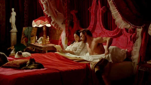 Angel - Romola Garai and Esmé Michael Fassbinder in bed with three longhair cats