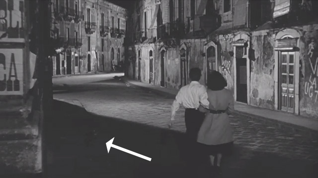 The Angel Wore Red - tabby cat on dark side of street as Soledad Ava Gardner and Father Arturo Dirk Bogarde run away