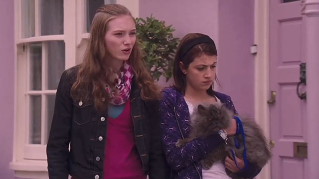 Angus, Thongs and Perfect Snogging - Smokey Persian Angus being carried by Georgia Groome with Jaz Eleanor Tomlinson
