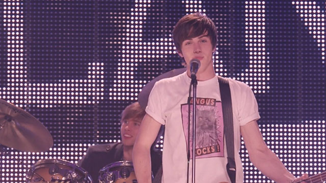 Angus, Thongs and Perfect Snogging - Smokey Persian Angus on t-shirt reading Angus Rocks worn by Robbie Aaron Taylor-Young
