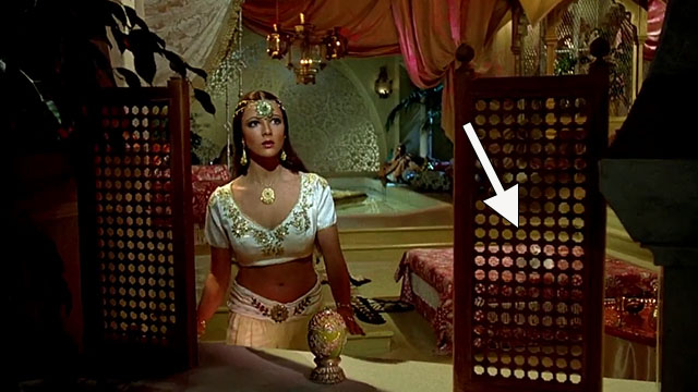 Arabian Adventure - longhair white cat behind screen next to Princess Zuleira Emma Samms