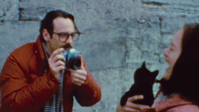 Argo - Joe Stafford Scoot McNairy taking photo of wife Kathy Kerry Bishé holding black kitten
