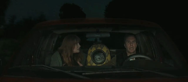 Argylle - Elly Bryce Dallas Howard with silver tabby Scottish fold cat Alfie Chip in bubble backpack and Aidan Sam Rockwell in car