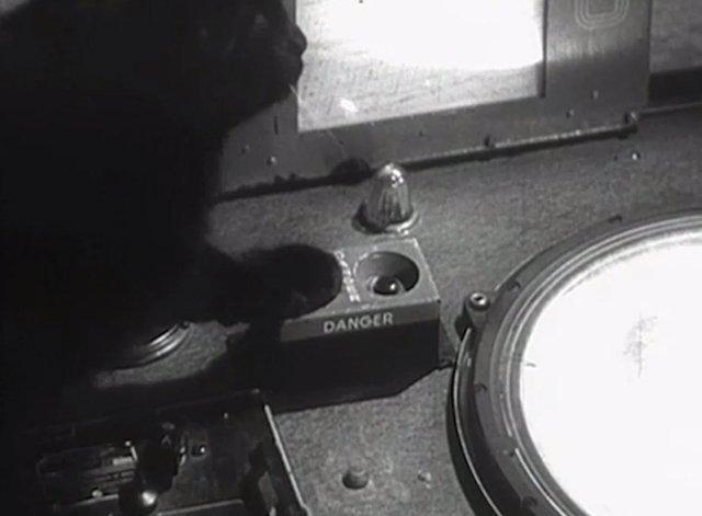 Monstrosity - The Atomic Brain - black cat Xerxes pressing button on atomic chamber control panel