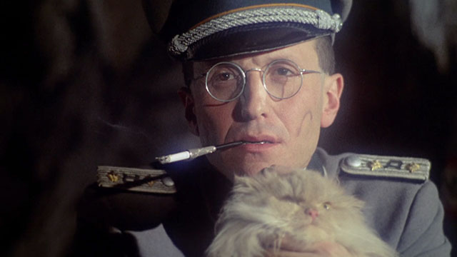 Baba Yaga - Nazi officer Corrado Farina holding cream Persian cat