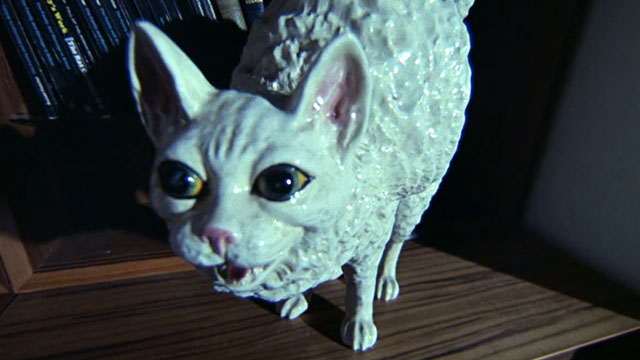 Baby Love - close up of scary white cat statue