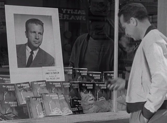 The Bad and the Beautiful - James Lee Bartlow Dick Powell looking into bookstore window with tabby cat