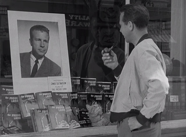 The Bad and the Beautiful - James Lee Bartlow Dick Powell looking into bookstore window with tabby cat