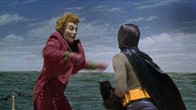 Batman the Movie - Batman Adam West holding black cat Hecate while fighting Joker Cesar Romero on submarine