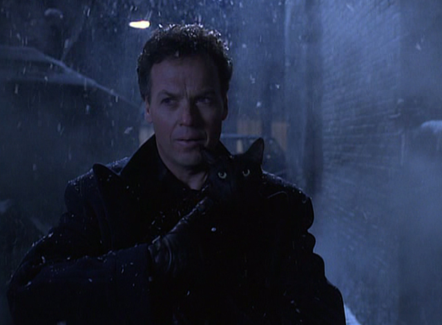 Batman Returns - Bruce Wayne Michael Keaton holding black cat in alley
