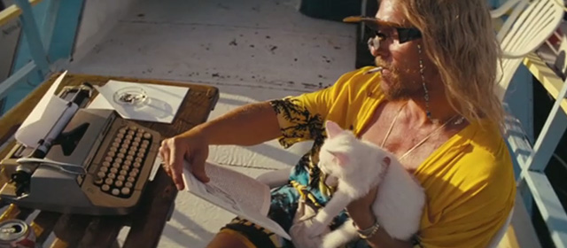 The Beach Bum - Moondog Matthew McConaughey writing with tiny white kitten