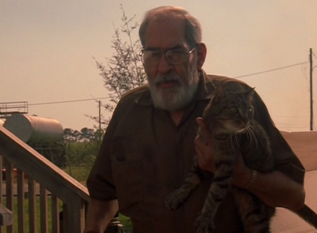 Because of Winn-Dixie - Mr. Alfred B.J. Hopper holding tabby cat