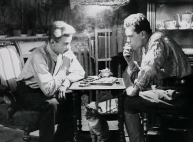 Bed and Sofa - tabby cat sitting under table where Volodia Vladimir Fogel and Kolia Nikolay Batalov are playing chess