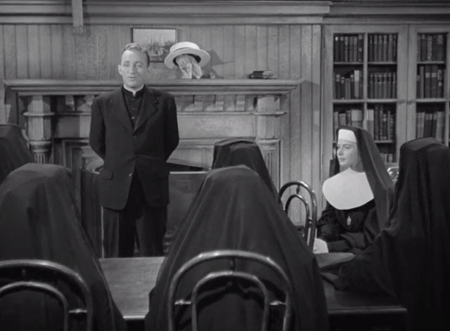 The Bells of St. Mary's - Father O'Malley Bing Crosby talking to nuns with tabby kitten Rosie inside straw hat on mantel