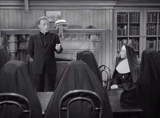 The Bells of St. Mary's - Father O'Malley Bing Crosby talking to nuns with tabby kitten Rosie with head in straw hat almost falling off mantel