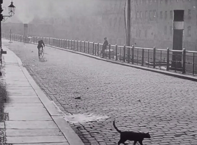 Berlin: Symphony of a Great City - black cat starting to cross street