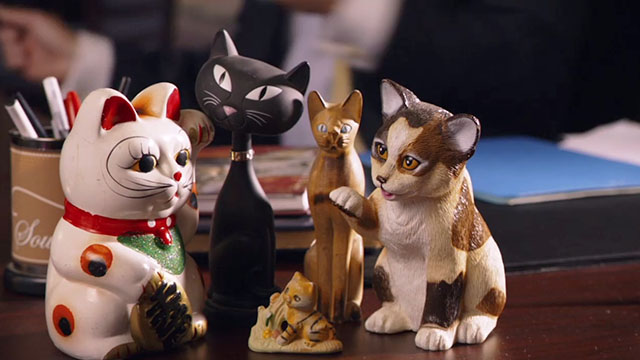 Beverly Hills Chihuahua 2 - cat figurines on bank manager Mr. Kroop's desk