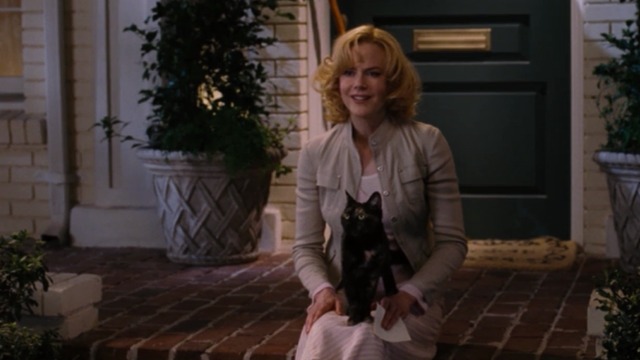 Bewitched - Lucinda tortoiseshell cat sitting on Isabel Nicole Kidman's lap