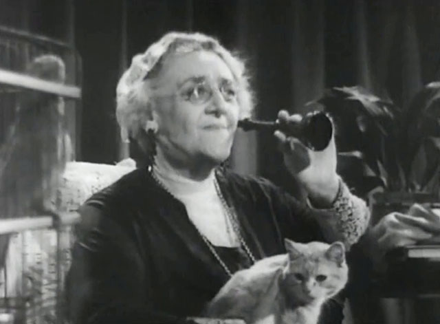Big Ben Calling - Radio Pirates - elderly woman sitting with ear trumpet listening to radio with ginger tabby cat on her lap