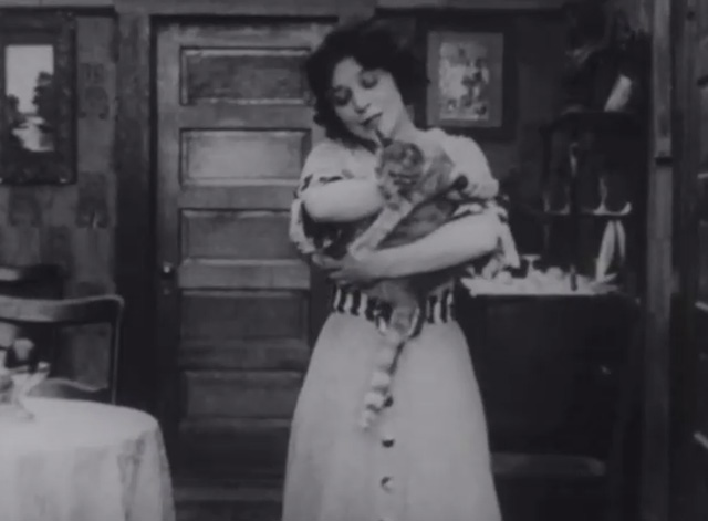 A Bird's a Bird - Mrs. Walrus Minta Durfee holding tabby cat