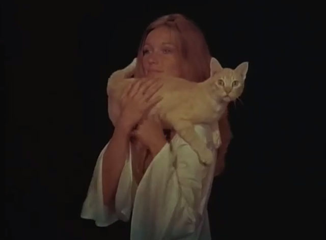 Black Noon - ginger tabby cat in Deliverance Yvette Mimieux arms 