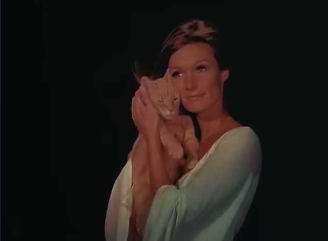 Black Noon - ginger tabby cat in Deliverance Yvette Mimieux arms