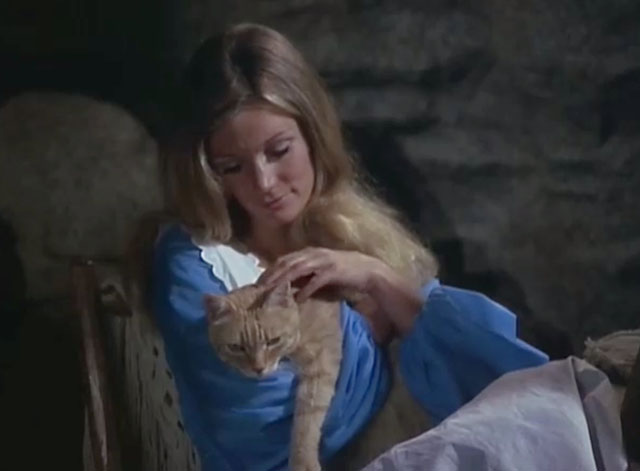 Black Noon - ginger tabby cat held by Deliverance Yvette Mimieux in rocking chair
