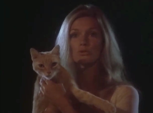 Black Noon - ginger tabby cat held by Deliverance Yvette Mimieux