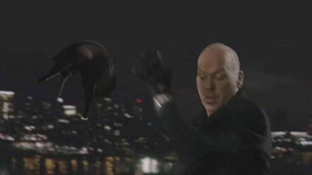 Blindsided - black cat Shadow being thrown over side of building by Hollander Michael Keaton