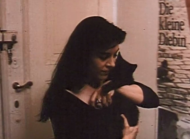 The Blue Hour - Marie Dina Leipzig hugging black kitten
