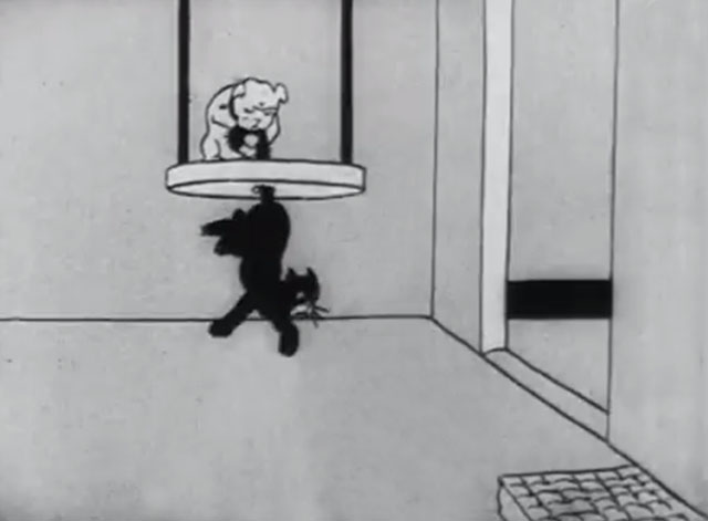 Bobby Bumps' Fight - a cartoon black cat being tied to punching bag frame by bulldog Fido