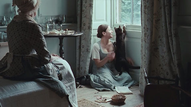 Bright Star - Fanny Abbie Cornish with tuxedo cat Topper jumping at butterfly