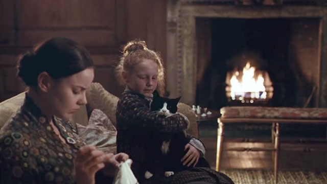 Bright Star - Fanny Abbie Cornish and Toots Edie Martin sitting with tuxedo cat Topper