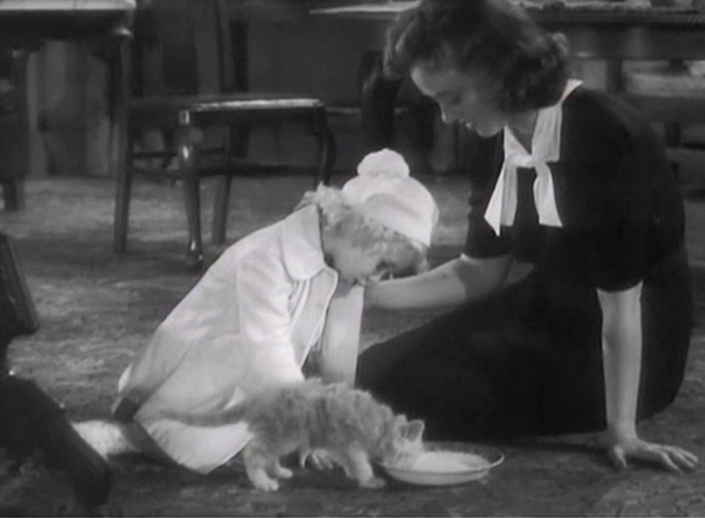 Broadway Musketeers - Isabel Margaret Lindsay and Judy Janet Chapman feeding small ginger tabby kitten from bowl on floor